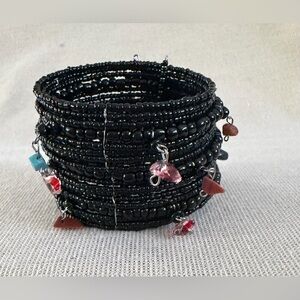 Black Beaded Coil Bracelet with Mixed Charms